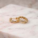 Argollas Trenza Zirconia Bañadas en Oro 18K
